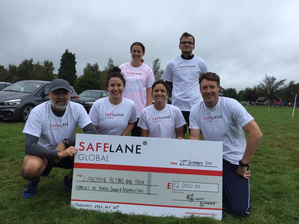 Adam with SafeLane staff raising money for charity